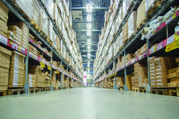 Rows of shelves with boxes in modern warehouse