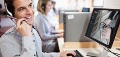Smiling,Assistant,Using,A,Headset,In,A,Call,Center Smiling,Assistant,Using,A,Headset,In,A,Call,Center
