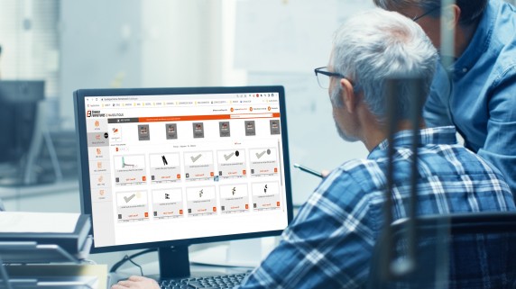 Two,Senior,Aircraft,Engineers,Working,With,Turbine,Blueprint,On,A