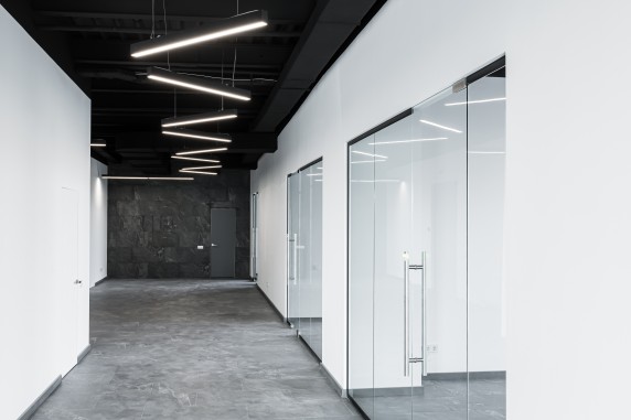 Interior photography, large spacious office center, with panoramic windows and unfurnished glass doors