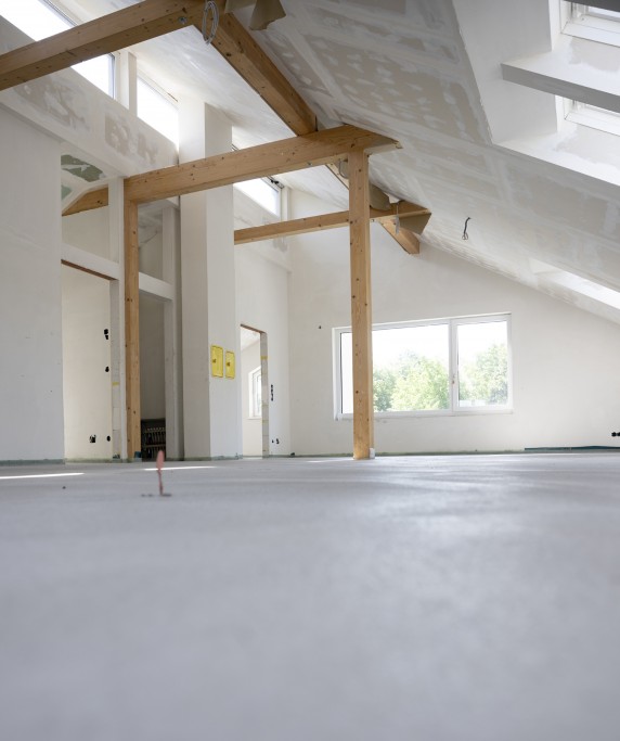 freshly cured concrete screed on construction site in family house